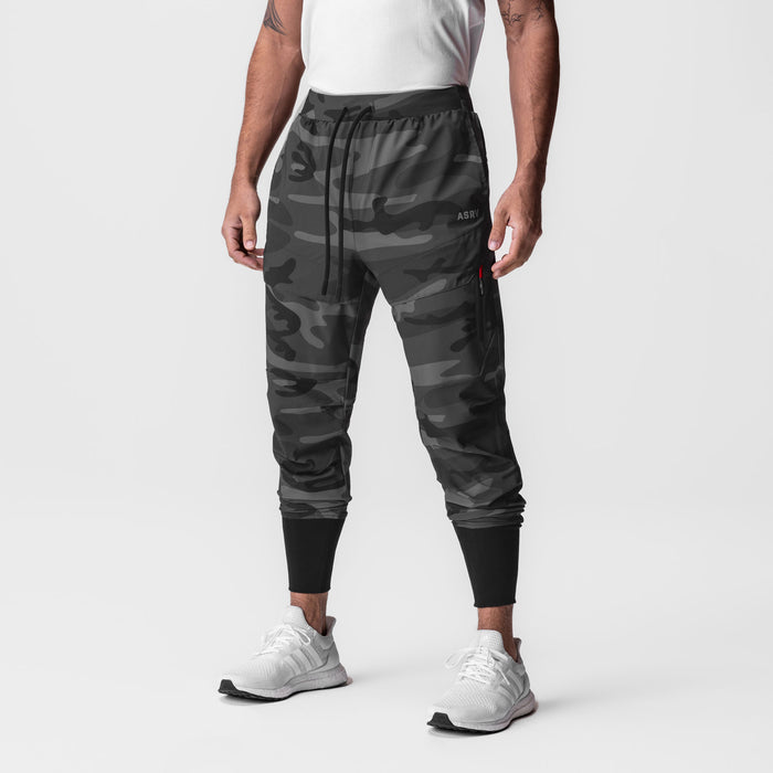Black camo Tetra-Lite Tech High Rib Jogger worn by male model, front view