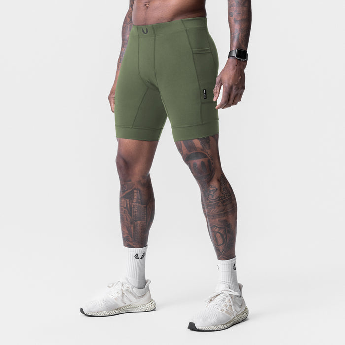 WarpFlexx® Side Pocket 1/2-Length Legging in olive, worn by model, side view