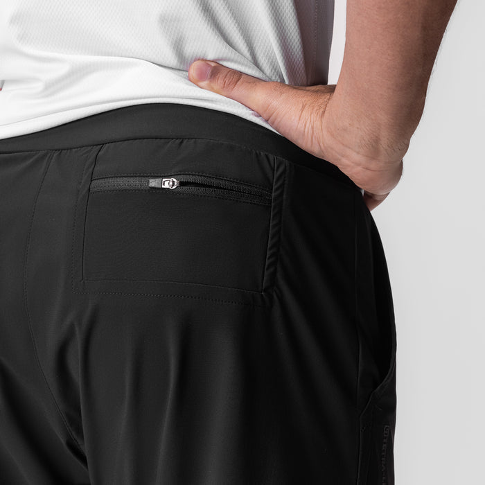 Tetra-Lite 5" Linerless Short in black, worn by model showing back pocket detail with zipper