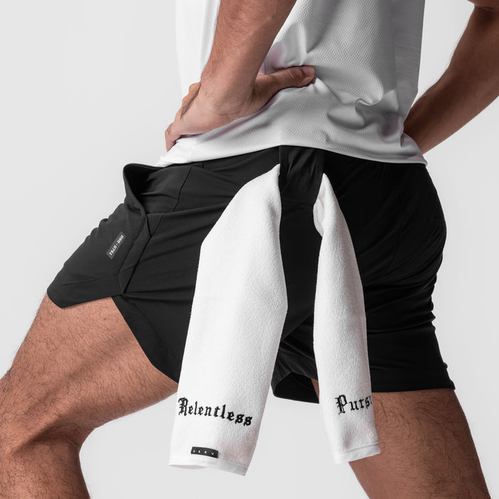 Tetra-Lite 5" Linerless Shorts in black with white towel, worn by model