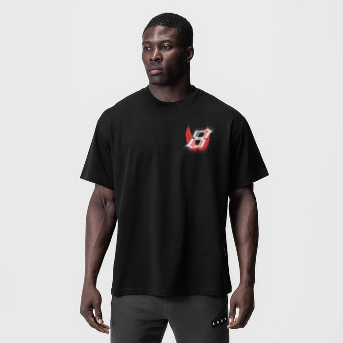 Black Tech Essential Relaxed Tee with red neon logo, worn by model, front view