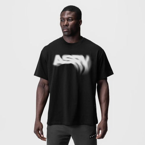 Black Tech Essential Relaxed Tee with 'Signal Lost' graphic, worn by model, front view