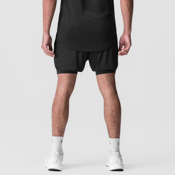 AeroSilver 5" Liner Short in black, rear view on model with white socks