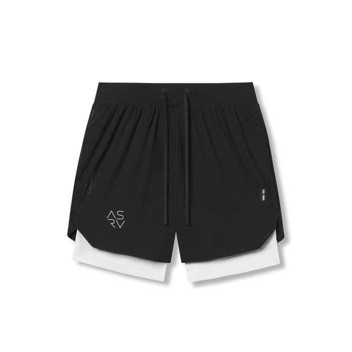 flatlay Tetra-Lite 7" Liner Shorts in black and white, front view