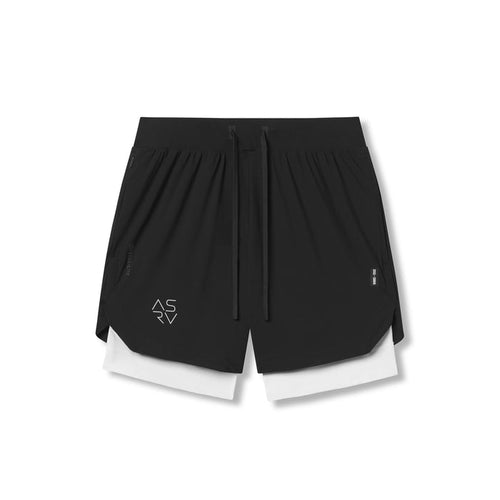 flatlay Tetra-Lite 7" Liner Shorts in black and white, front view