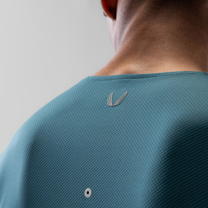 AeroSilver Training Long Sleeve in storm blue worn by model, back view showing logo detail