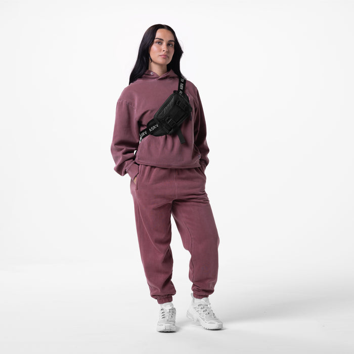 Tech Essential™ Sweats in Faded Crimson worn with matching hoodie and black waist bag