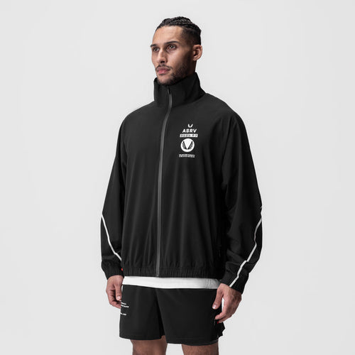 Aerotex™ Track Jacket in black with white trim, worn by model, front view