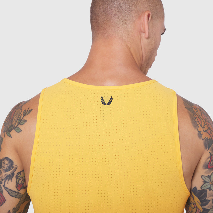 Laser-Vent Tank Top in amber yellow worn by model, back view showing perforated mesh fabric