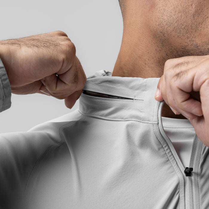 Aerotex™ Weather-Ready Bonded Windbreaker in slate grey, model wearing and displaying zipper detail