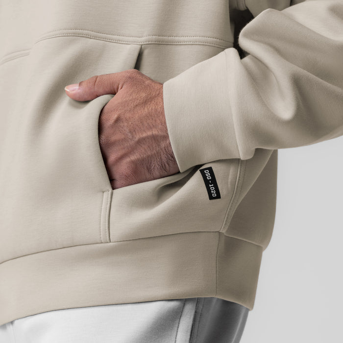 Dri-Core Oversized Crewneck in Chai, model wearing hoodie with hand in front pocket