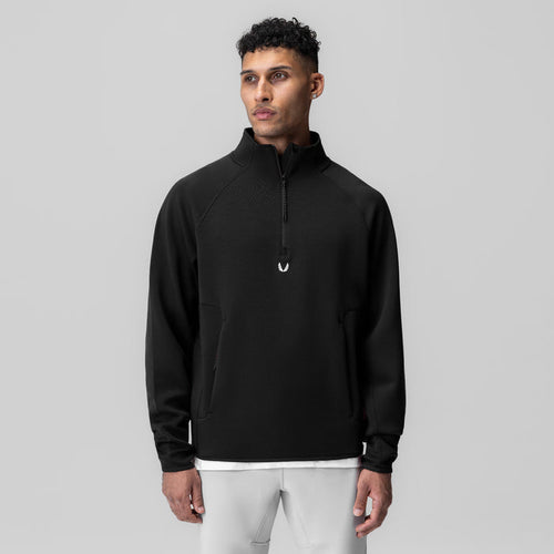 Dri-Core Quarter Zip in black worn by male model, front view