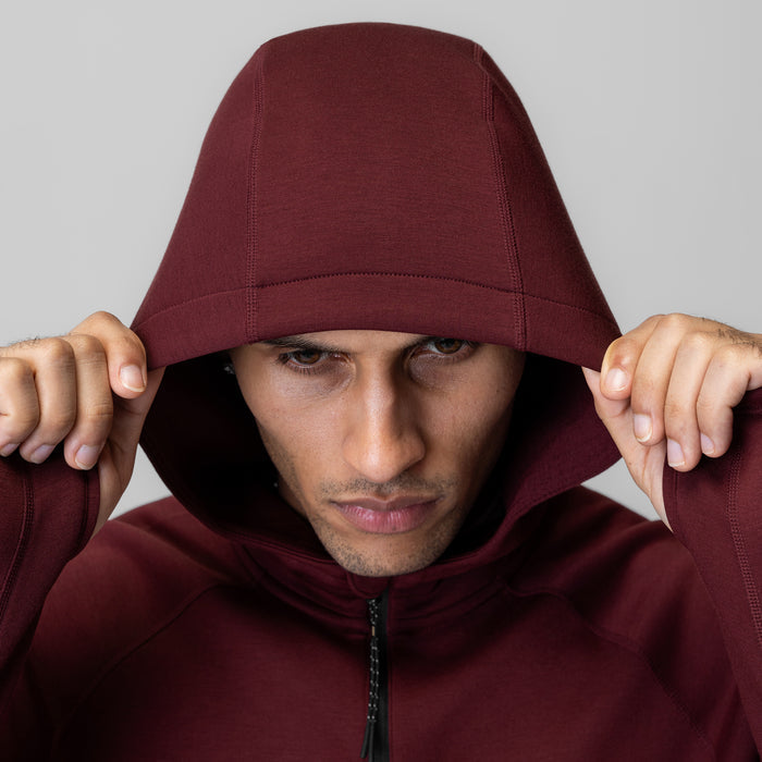 Dri-Core™ Zip Hoodie in crimson, model wearing hoodie pulled over head