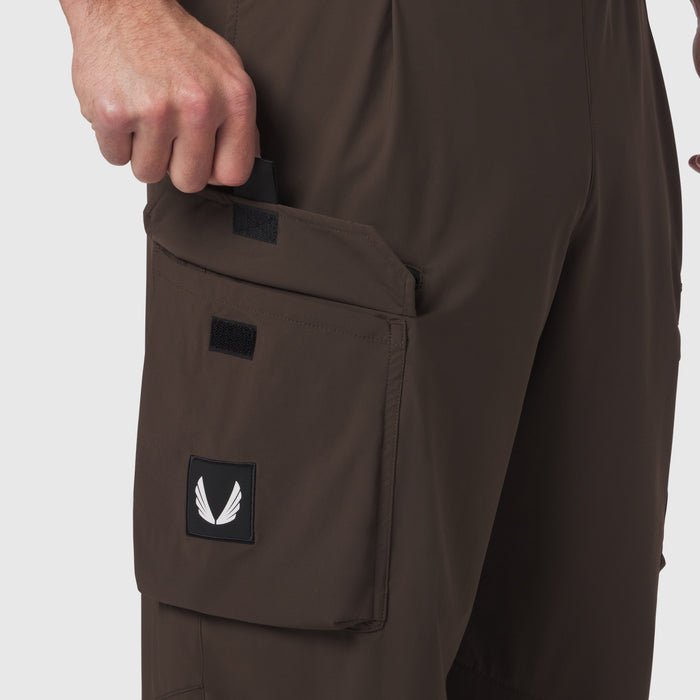 Tetra-Lite® Cargo City Pant in Dark Earth, model wearing pants with hand in cargo pocket