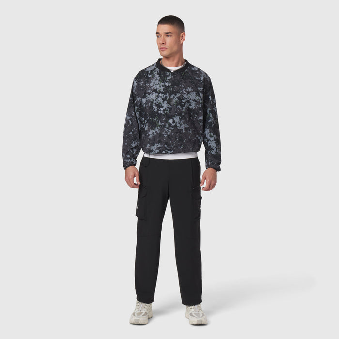 Tetra-Lite Blade Collar Zip Jacket in pixel camo worn with black cargo pants, front view