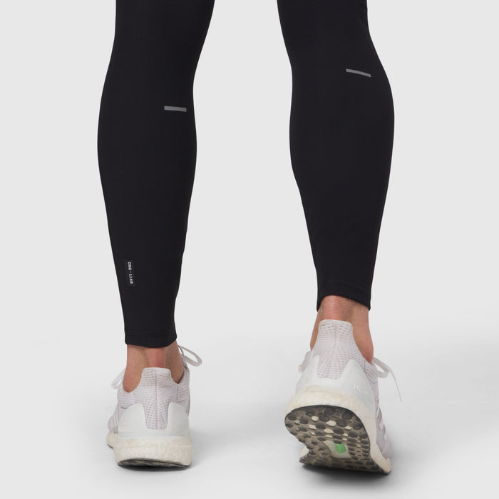 Black Lycra® Ribbed Running Tight worn by model from behind, showing fit and white sneakers