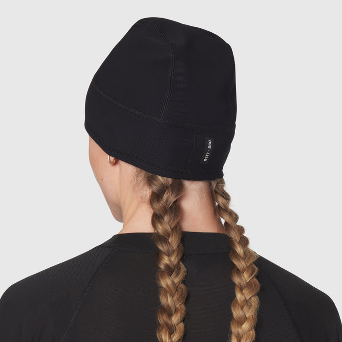 Black Lycra Skully beanie worn by model from back view, showing braided hair detail