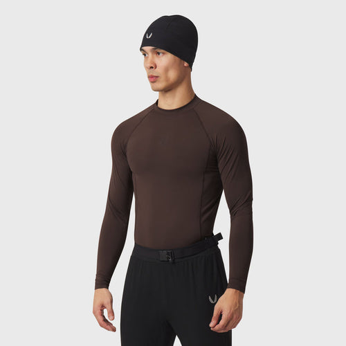 LYCRA® ADAPTIV Baselayer Longsleeve in dark earth brown, worn by model, front view