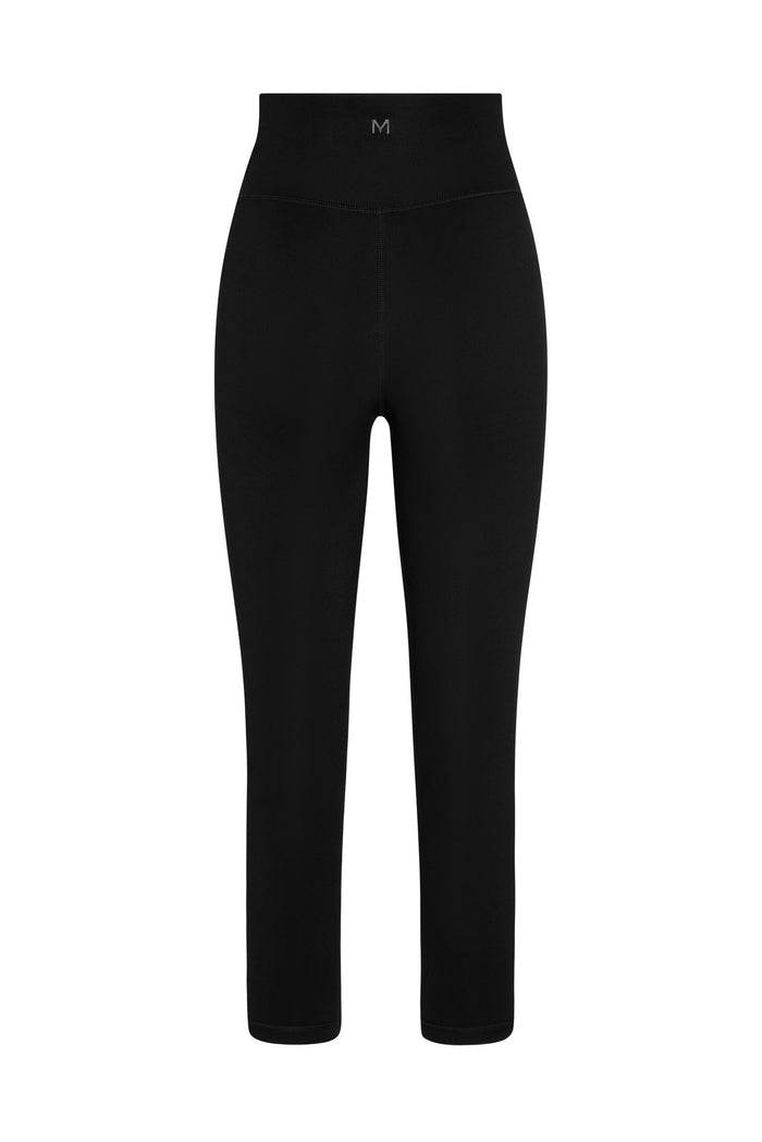Front view of Acadia cropped legging in black with high-rise wide waistband, mid-calf and small M logo on white background