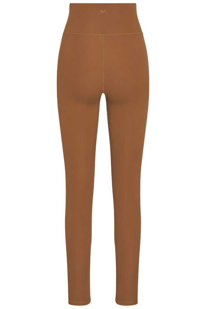 Back view of Acadia Legging Long in caramel showing high doubled waistband, rear seam detail, and long leg on white background