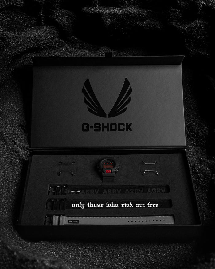 flatlay ASRV x G-SHOCK DW6900 watch set with bands and accessories in black, overhead view
