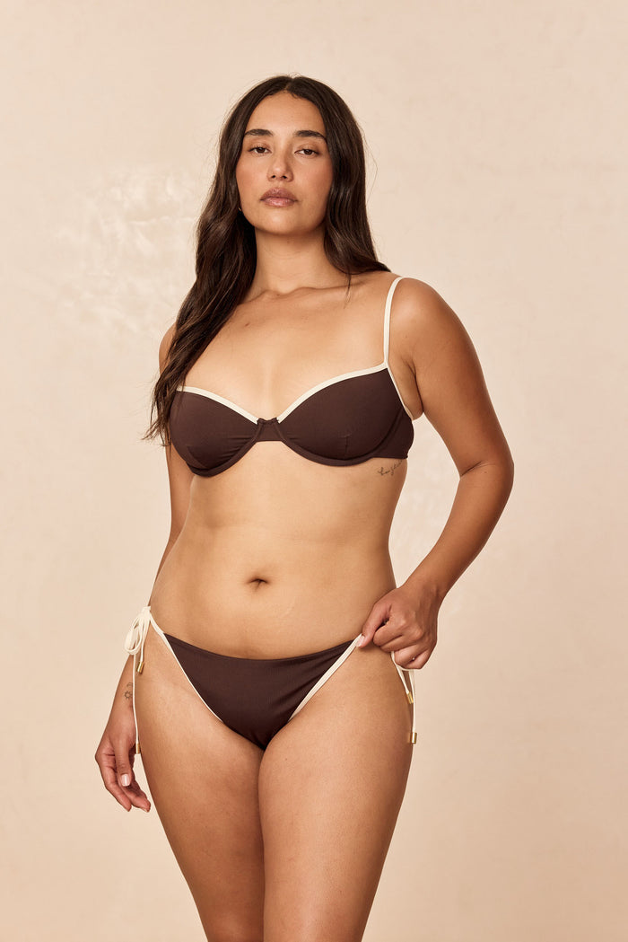 Front view of Capri Top in Espresso/Ivory on model showcasing underwire cups and ivory contrast trim against beige background