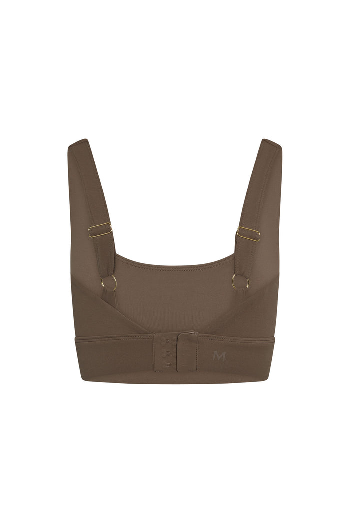 Back view of Devin Bra in Stone with three row hook and eye closure, wide adjustable straps, and supportive underband on white background