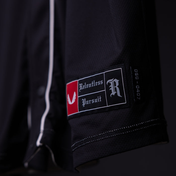 FA'21 Reversible Jersey label closeup detail on black fabric