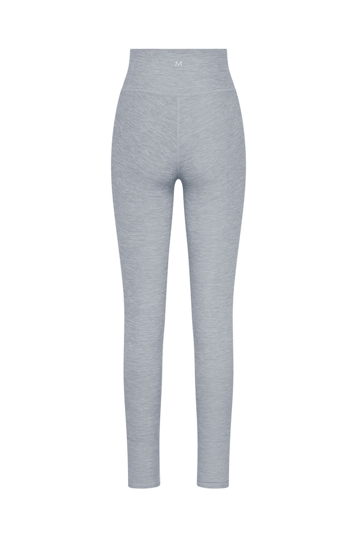 Light gray seamless high-waist leggings, back view with small 'M' logo on waistband.