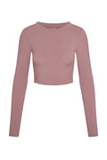 Front view of Hayworth long-sleeve cropped top showcasing mauve lightweight rib fabric and crew neckline on white background