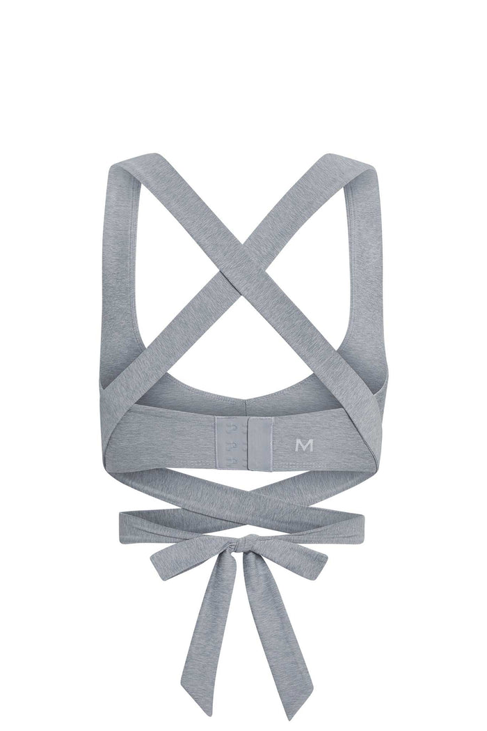 Back view of Hudson Bra in heather grey showcasing crossed straps, wrap-around tie and hook-and-eye back on white background