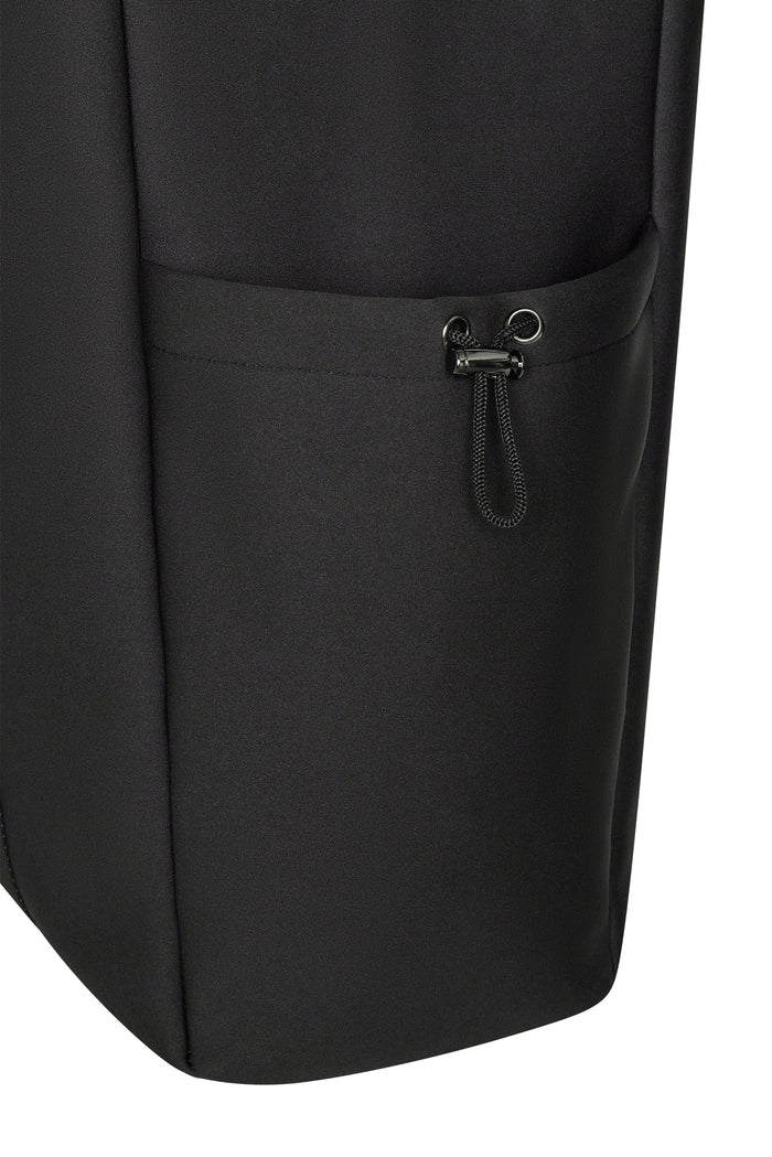 Close-up side view of Monday Body Tote Bag showing exterior pocket with cord toggle on white background
