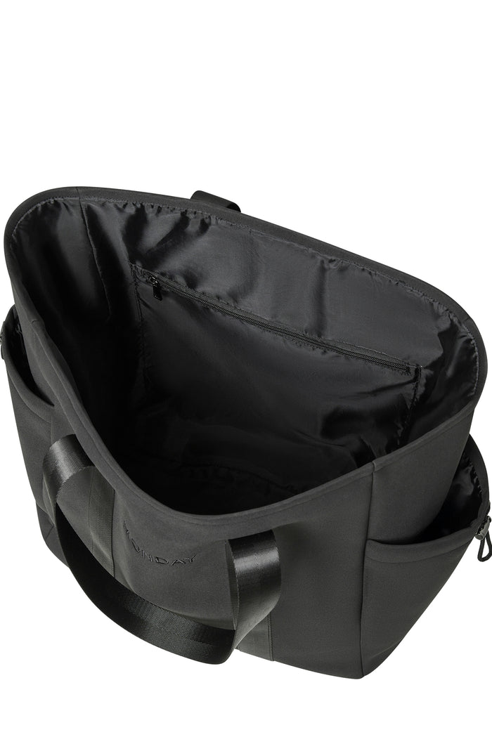 Top-down view of Monday Body Tote Bag in black showcasing open interior with zip pocket and exterior side pocket on white background