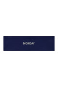 Flat lay of Monday Headband in midnight navy showing centered white "MONDAY" embroidery on a white background