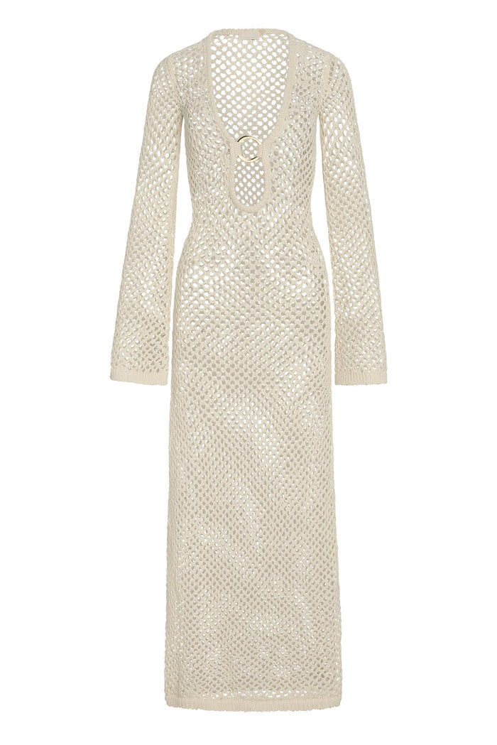 Front of Montego Dress in ivory chunky crochet, open-knit maxi with long sleeves and deep scoop neckline with gold ring