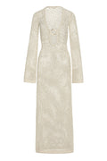 Front of Montego Dress in ivory chunky crochet, open-knit maxi with long sleeves and deep scoop neckline with gold ring
