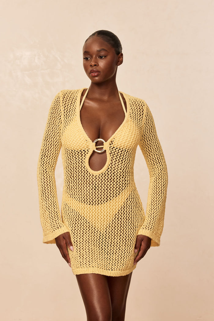 Front of Montego Mini Dress in Honey petit crochet with open-knit long sleeves, mini length, and ring-front cutout