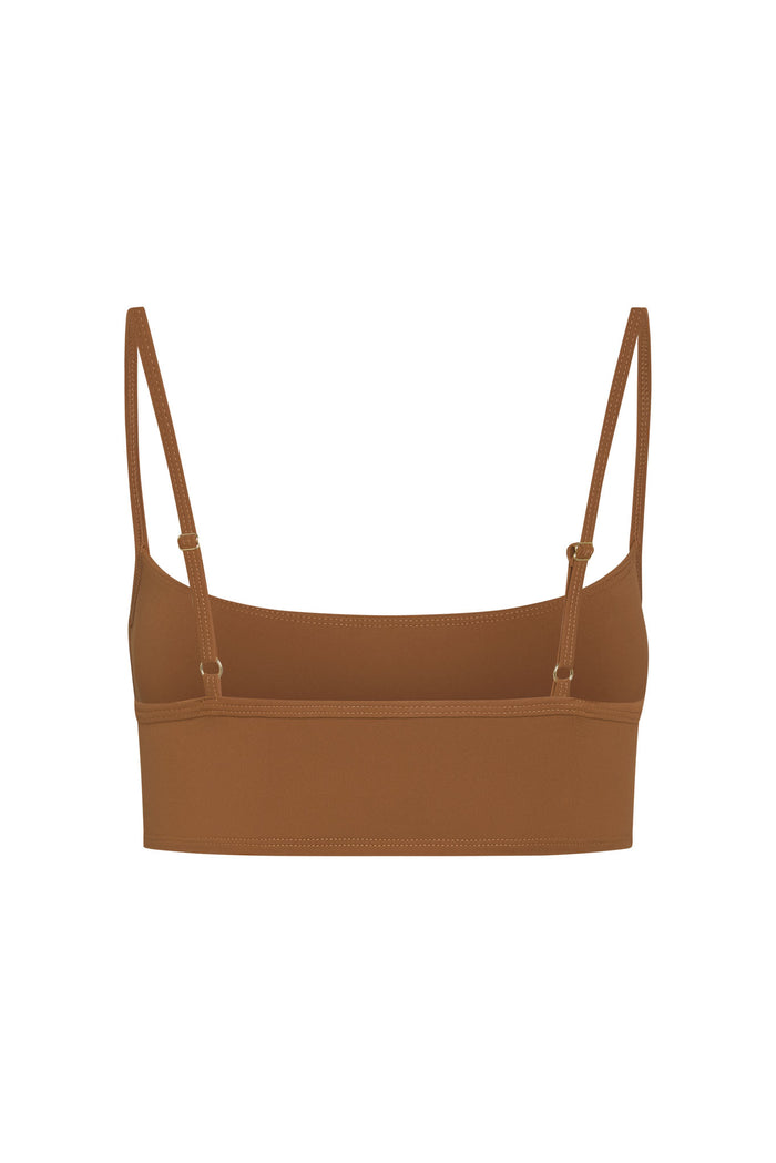 Back view of Olympic Bra in Caramel showing adjustable thin straps and wide supportive underband on white background