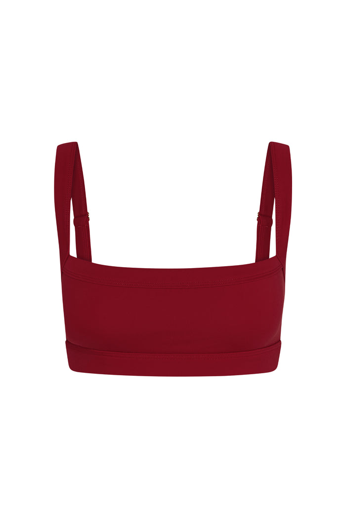 Front view of Outpost Bra in Cherry showcasing straight neckline and adjustable shoulder straps on white background