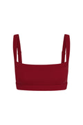 Front view of Outpost Bra in Cherry showcasing straight neckline and adjustable shoulder straps on white background