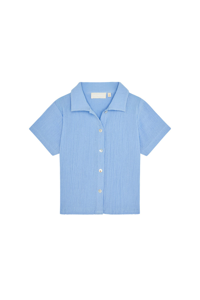 Front view of Pacific Beach Shirt Kids in Sky showcasing crinkle texture, short sleeves and button-front design on white background