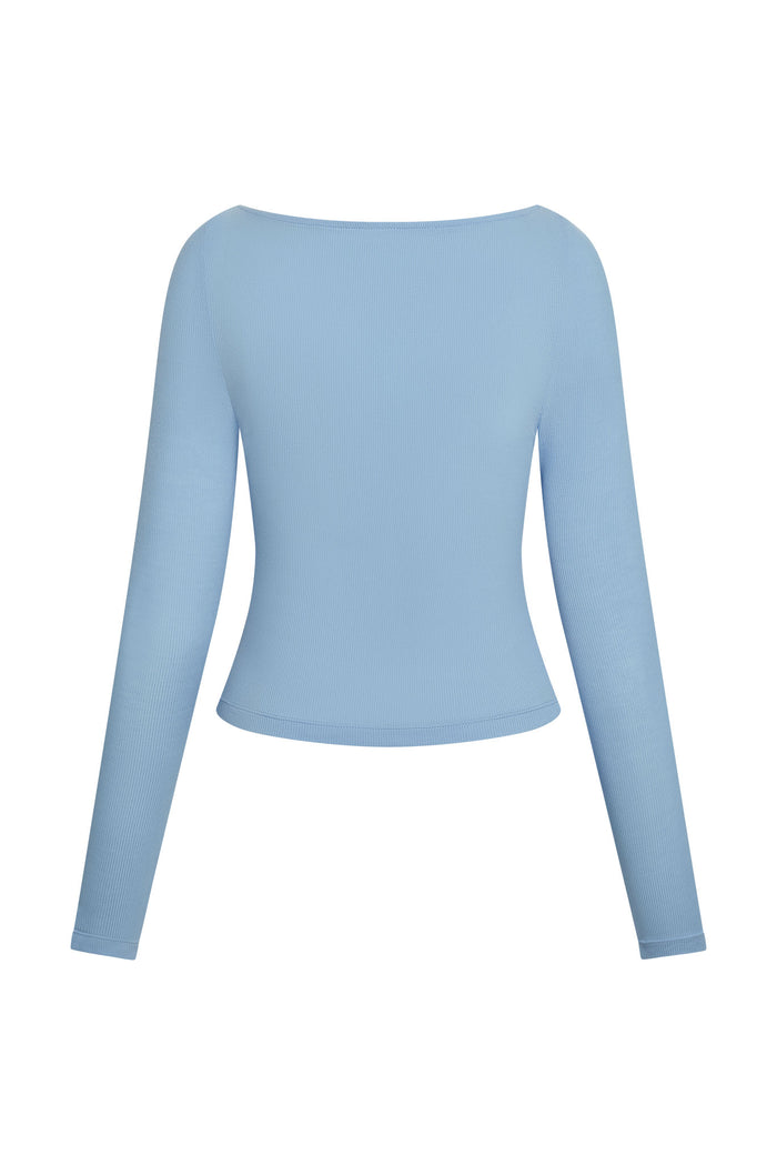 Back view of Paddington Long Sleeve top showcasing lightweight rib texture and cropped fit on white background
