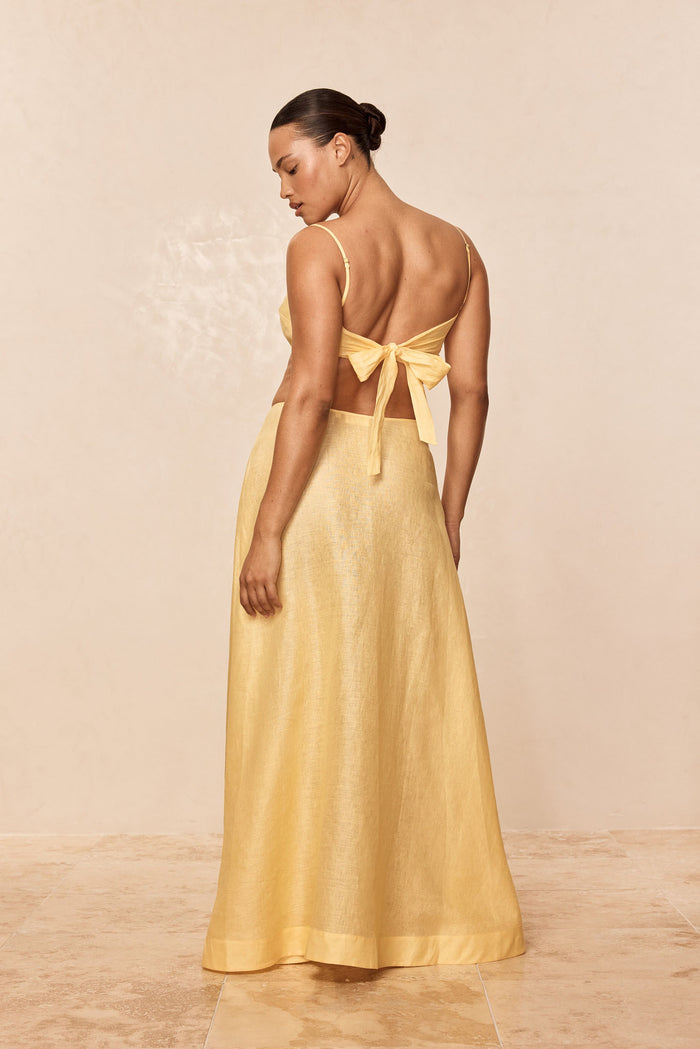 Back view of San Diego Top in Honey showing adjustable straps and back tie on model with neutral background