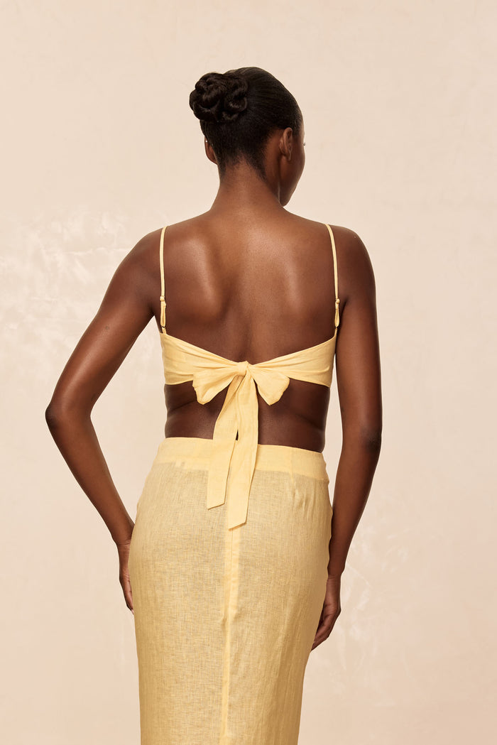 Back view of San Diego Top in Honey showing adjustable straps and tied back closure with neutral background