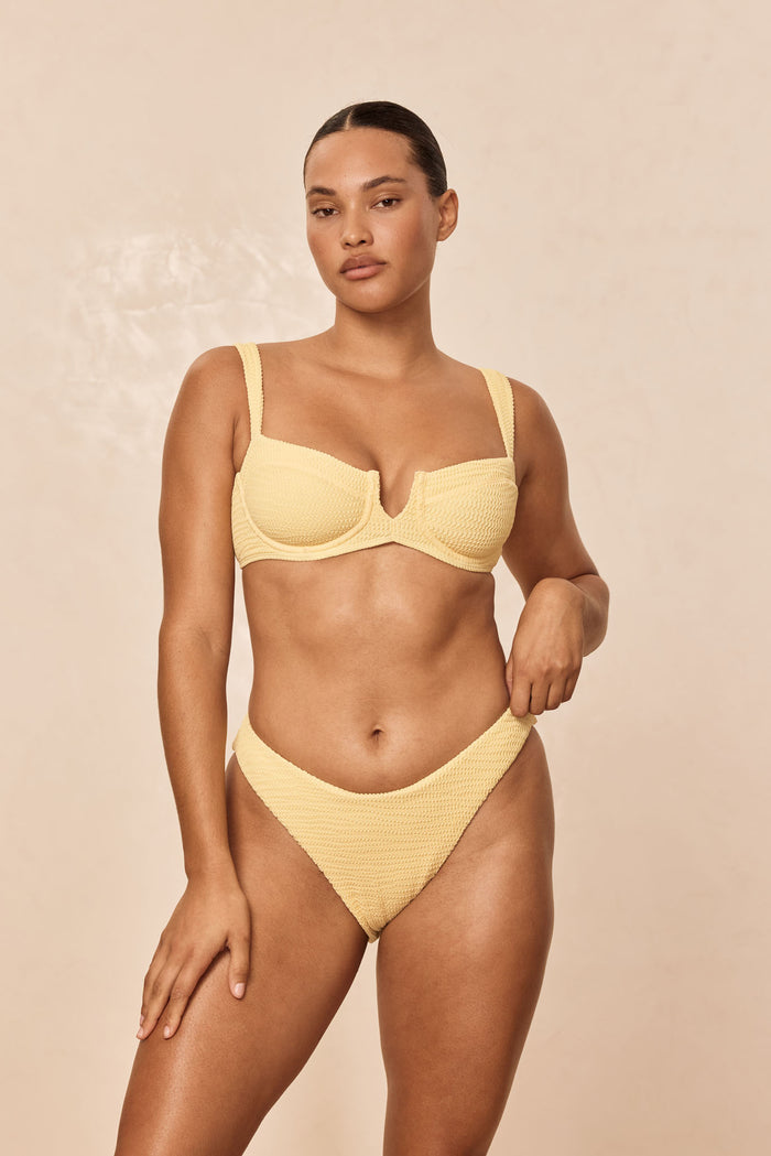 Front view of Clovelly Top in Honey Crinkle, balconette underwire, crinkle texture, wide straps, beige studio background