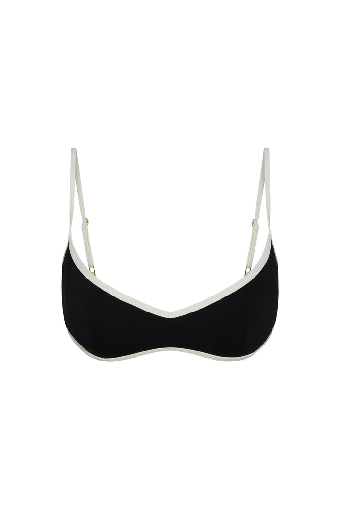Front view of Soho Bra in black with ivory trim, showing V-neckline, thin adjustable straps and contrast colorblock on white background