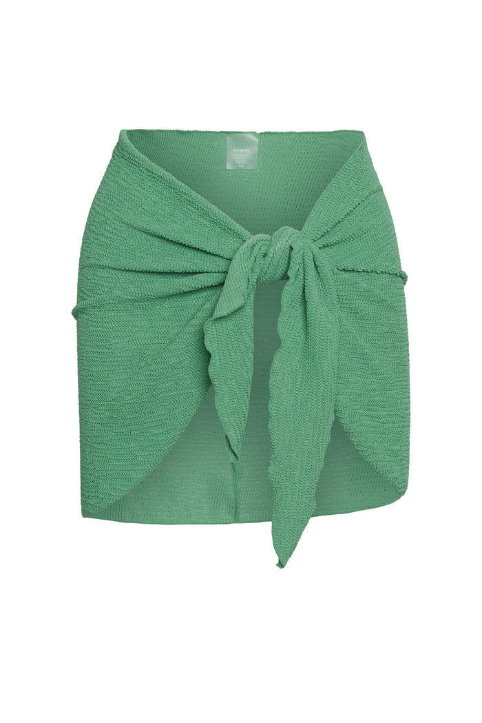 Green textured wrap skirt tied in a front knot with MONDAY label at waist
