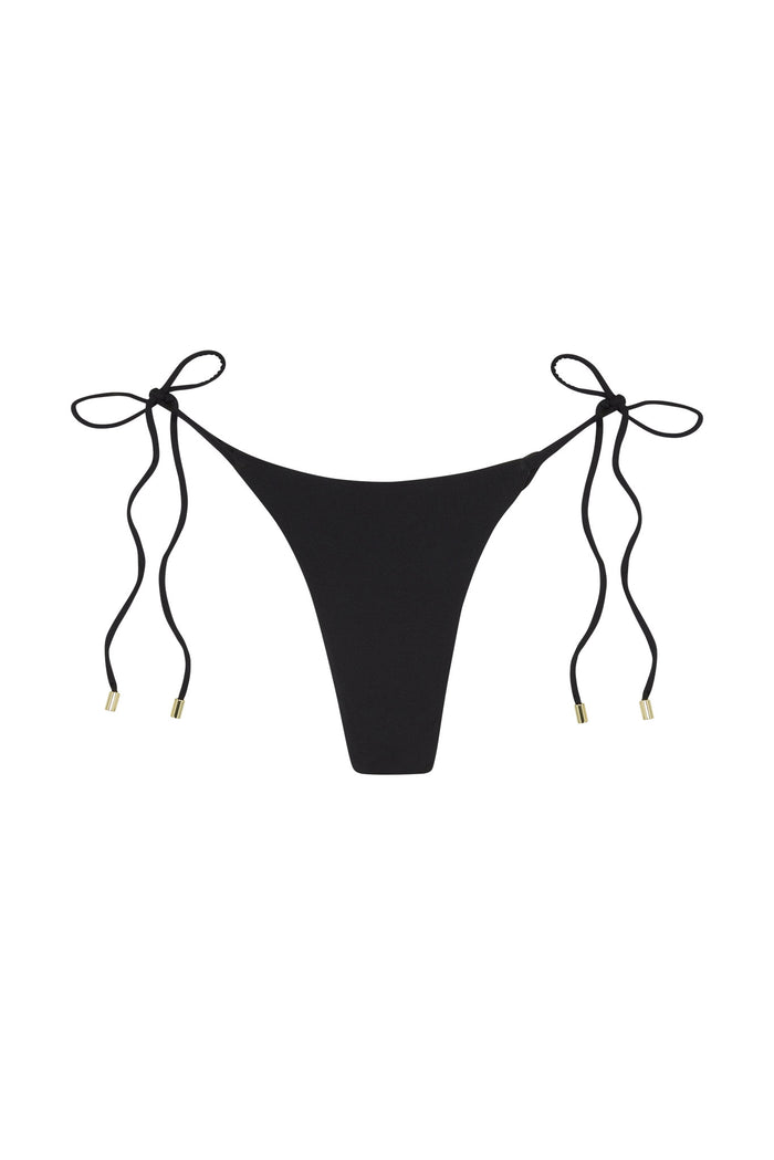 Front view of Taormina black tie-side bikini bottom, high-cut thong silhouette with gold-tipped ties on white background