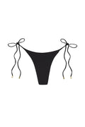 Front view of Taormina black tie-side bikini bottom, high-cut thong silhouette with gold-tipped ties on white background