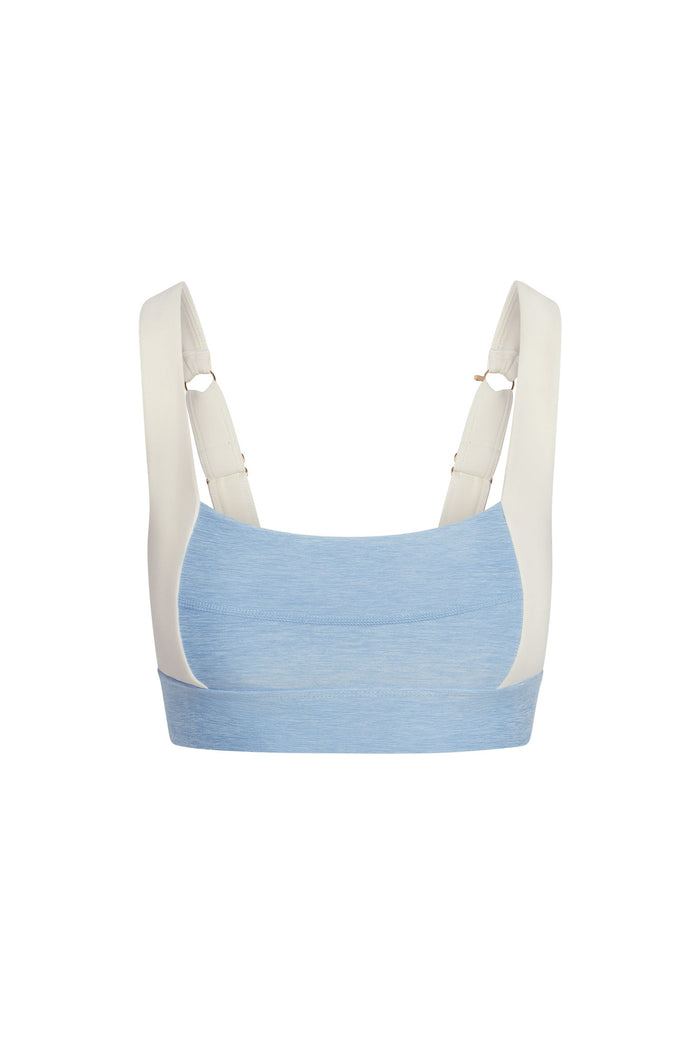 Back view of Tash Bra in Heather Sky and Ivory showing wide adjustable straps, back hook hardware and thick underbust band on white background